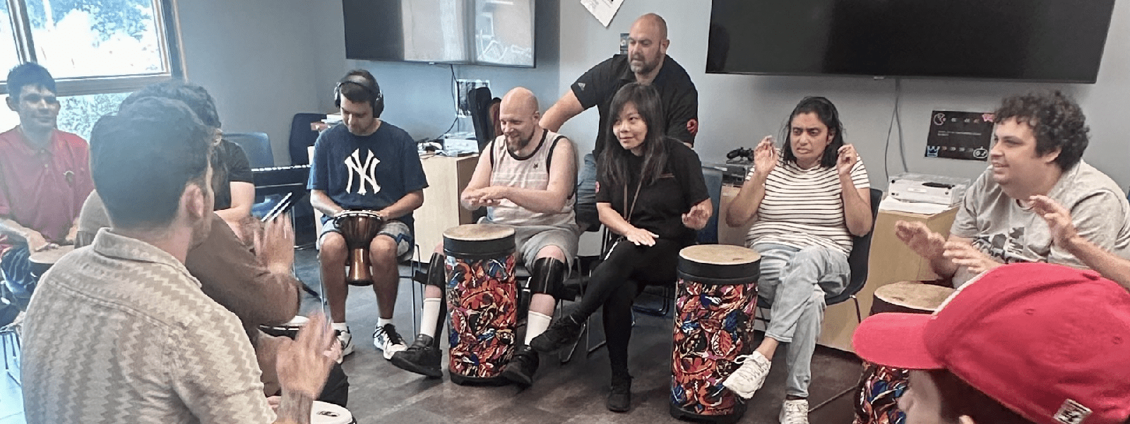 RCAAS participants take part in a music class in the center