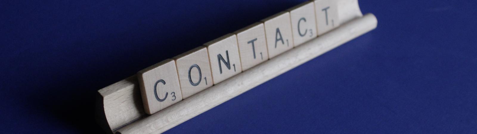 "Contact" written out in Scrabble letters